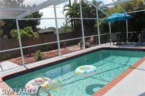 a view of a chair and tables in the patio