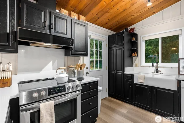 a kitchen with a stove and a sink