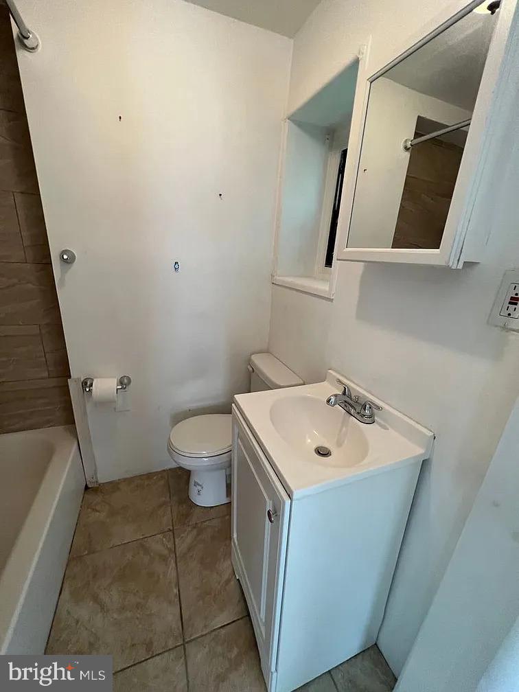 501 East Haines Street, Unit 3 Philadelphia, PA 19144 - Photo 5 of 6 a bathroom with a sink a toilet and a mirror