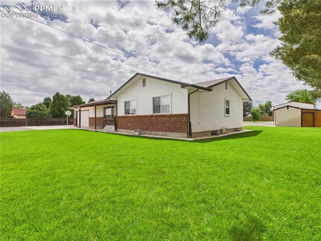 32006 Ford Road Pueblo, CO 81006 - Photo 11 of 50 a view of house with yard and green space