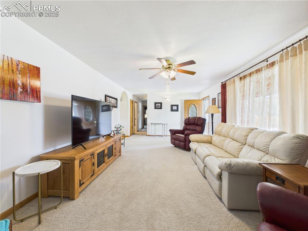 32006 Ford Road Pueblo, CO 81006 - Photo 13 of 50 a living room with furniture and a flat screen tv