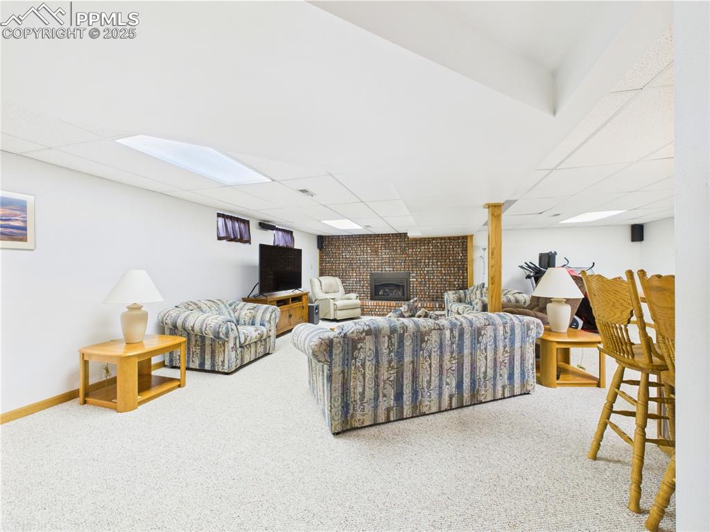 32006 Ford Road Pueblo, CO 81006 - Photo 34 of 50 a living room with furniture and a flat screen tv
