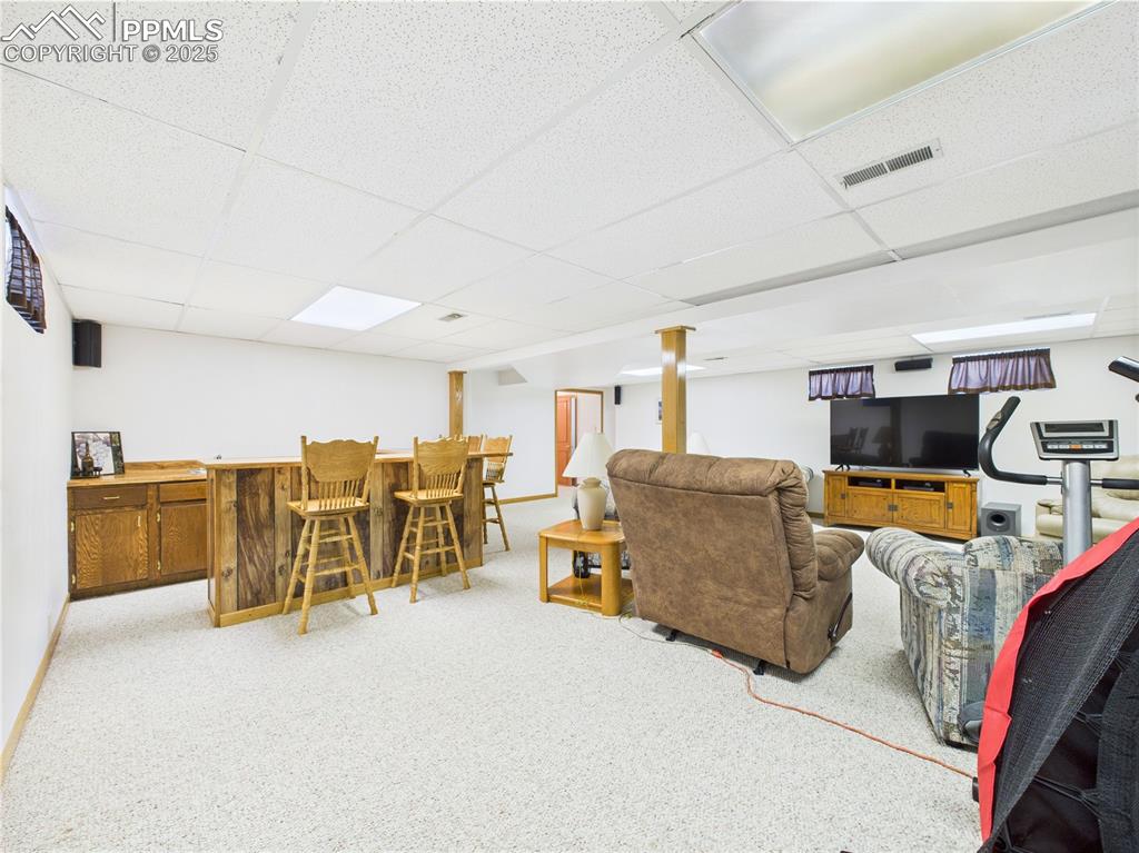 32006 Ford Road Pueblo, CO 81006 - Photo 36 of 50 a living room with furniture and a flat screen tv