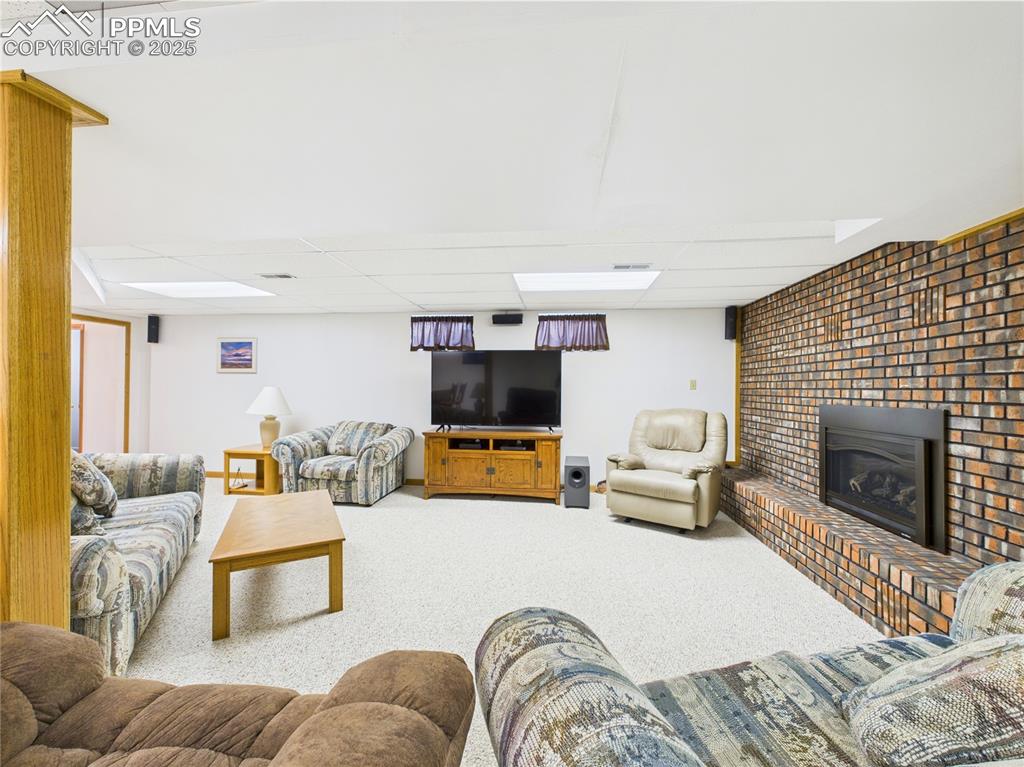 32006 Ford Road Pueblo, CO 81006 - Photo 37 of 50 a living room with furniture and a fireplace