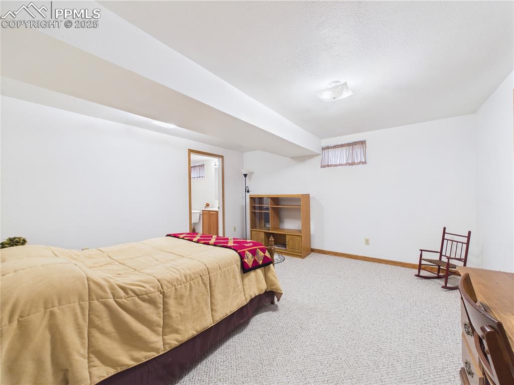 32006 Ford Road Pueblo, CO 81006 - Photo 43 of 50 a bed room with a bed and a chair