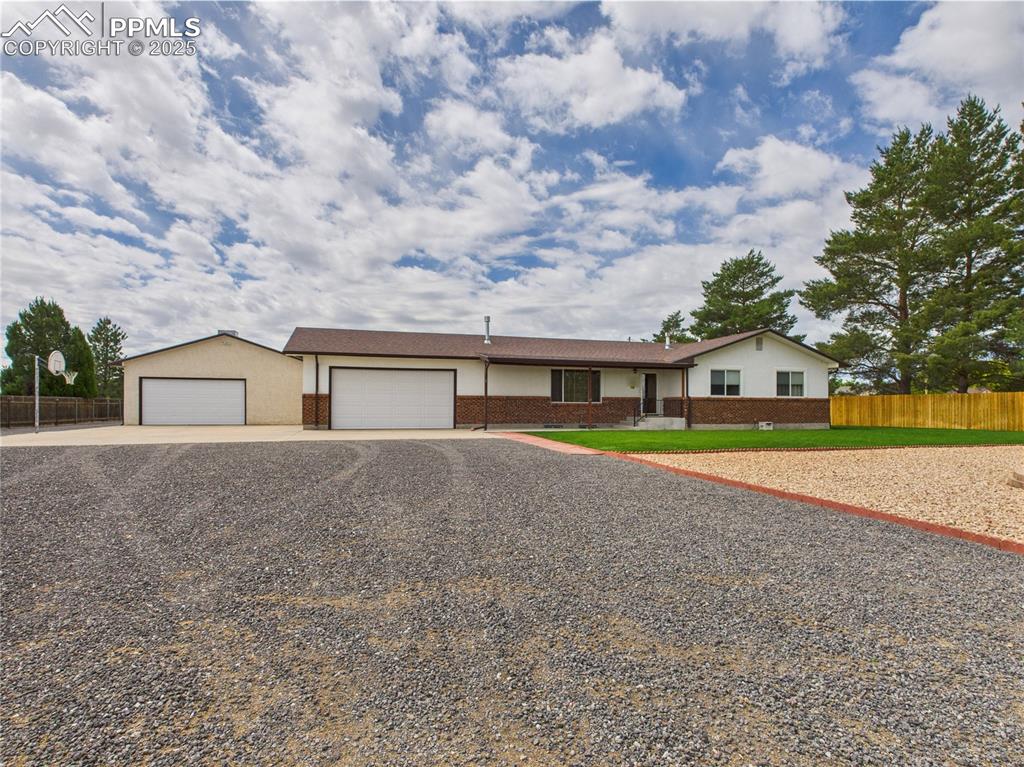 32006 Ford Road Pueblo, CO 81006 - Photo 6 of 50 a front view of house with yard and garage