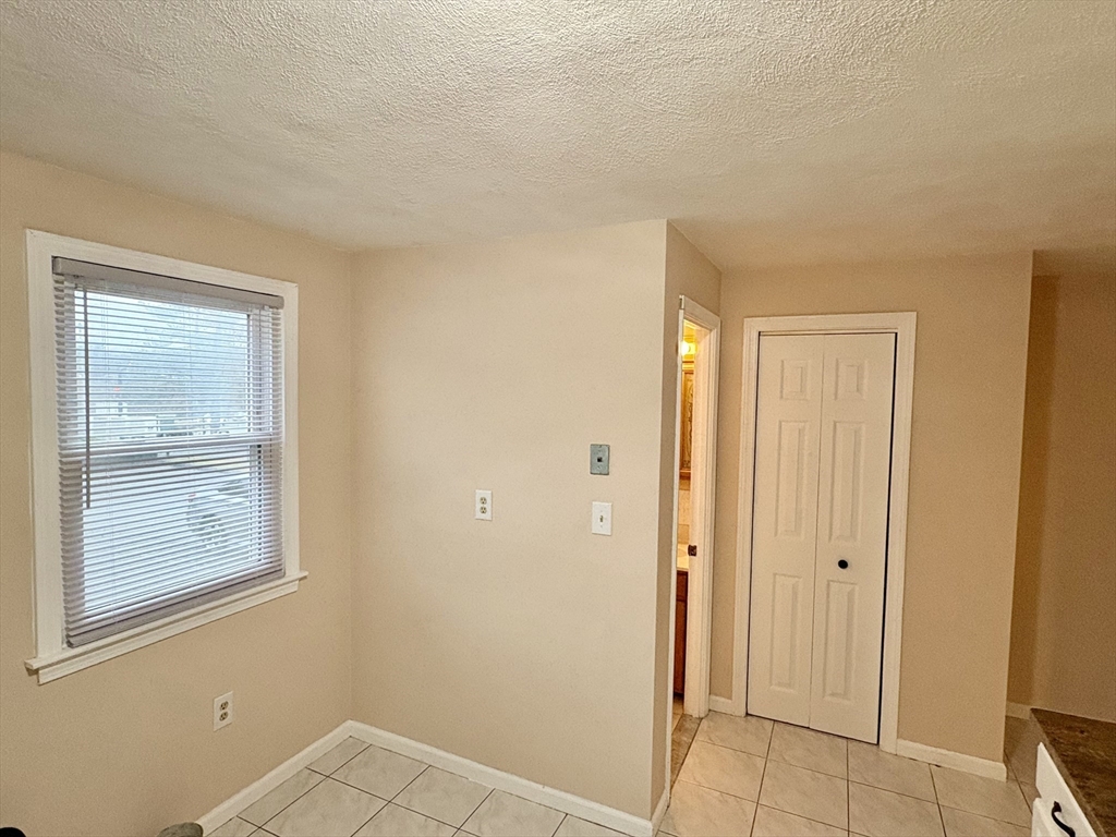 224 Park Street, Unit B2 Stoneham, MA 02180 - Photo 11 of 35 an empty room with windows and closet