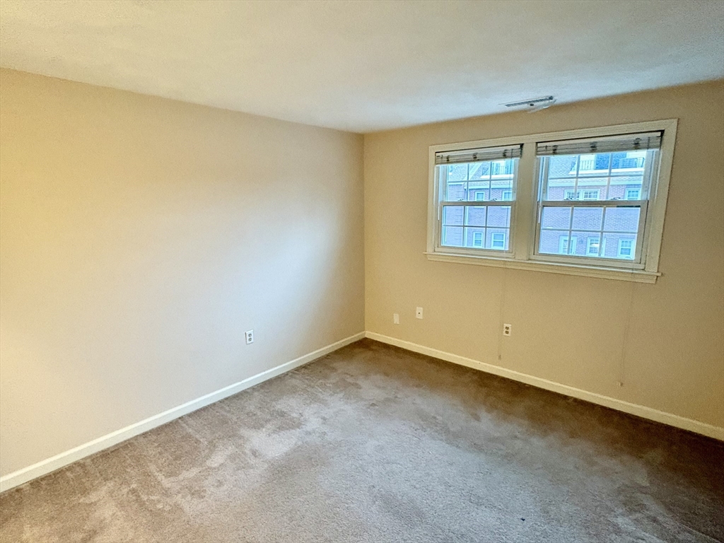 224 Park Street, Unit B2 Stoneham, MA 02180 - Photo 13 of 35 an empty room with a window