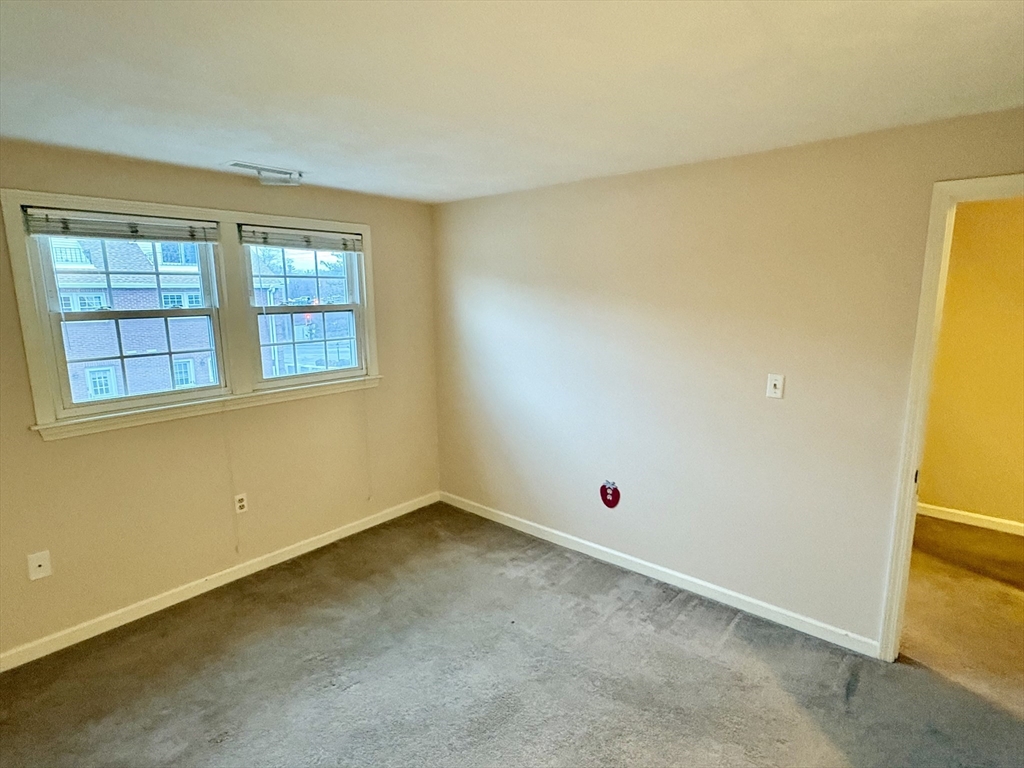 224 Park Street, Unit B2 Stoneham, MA 02180 - Photo 14 of 35 an empty room with a window