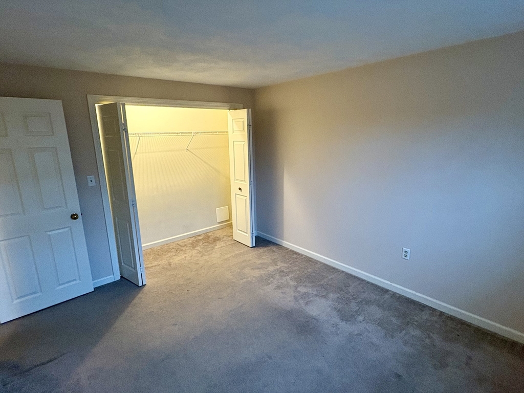224 Park Street, Unit B2 Stoneham, MA 02180 - Photo 16 of 35 an empty room with a dresser