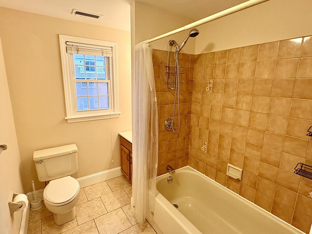 224 Park Street, Unit B2 Stoneham, MA 02180 - Photo 17 of 35 a bathroom with a sink toilet and shower