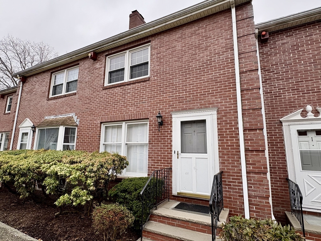 224 Park Street, Unit B2 Stoneham, MA 02180 - Photo 2 of 35 a front view of a house with a garden