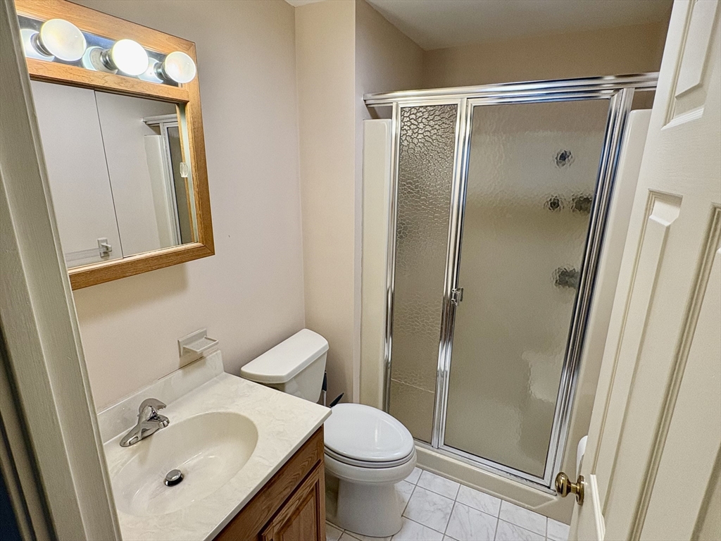 224 Park Street, Unit B2 Stoneham, MA 02180 - Photo 22 of 35 a bathroom with a sink toilet and shower