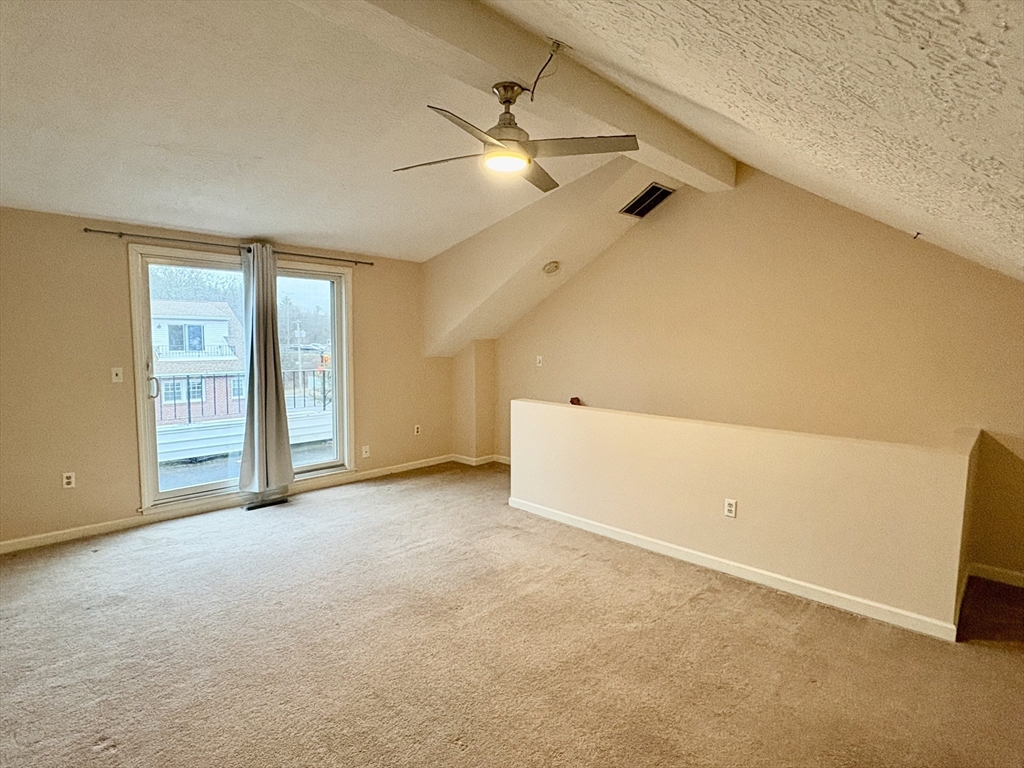 224 Park Street, Unit B2 Stoneham, MA 02180 - Photo 26 of 35 an empty room with windows