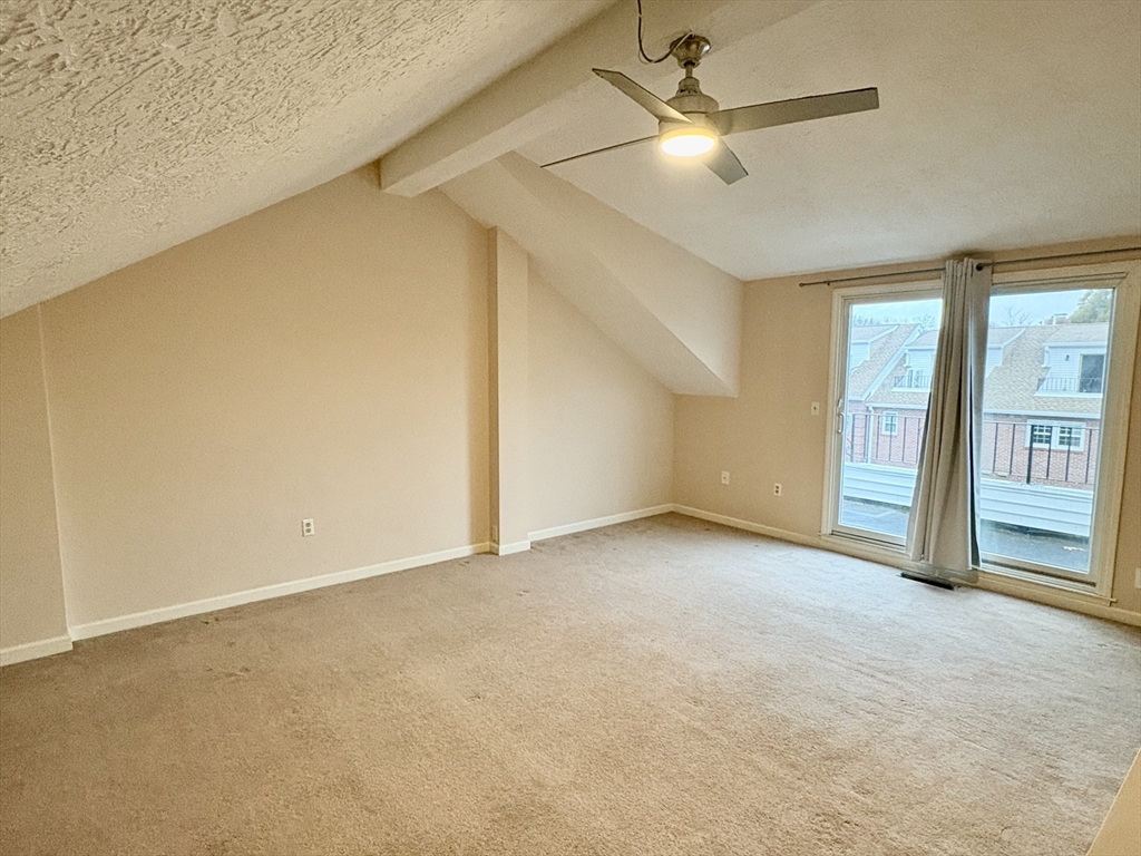 224 Park Street, Unit B2 Stoneham, MA 02180 - Photo 27 of 35 an empty room with fan and windows