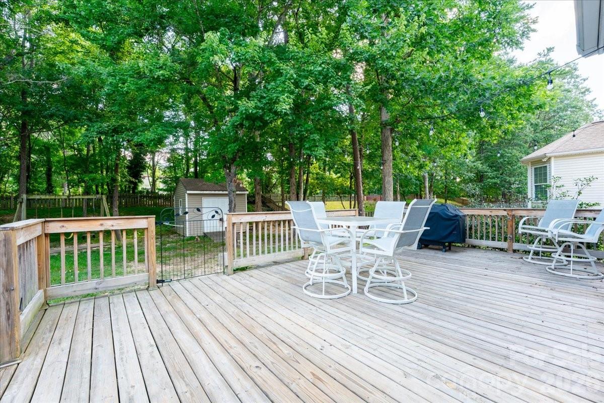 8006 Fine Robe Drive Indian Trail, NC 28079 - Photo 34 of 36 a view of a chairs and table on the wooden floor