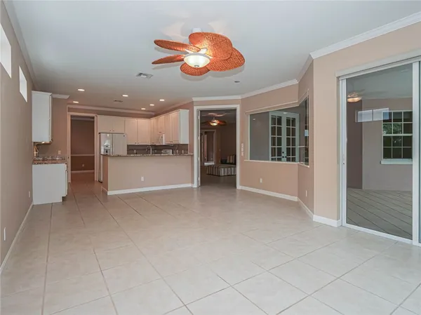 a view of a kitchen with a refrigerator and a sink