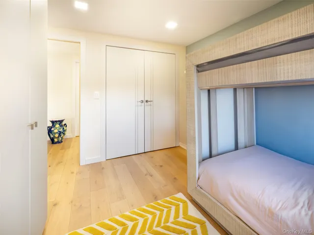 a bedroom with a bed and a table in it