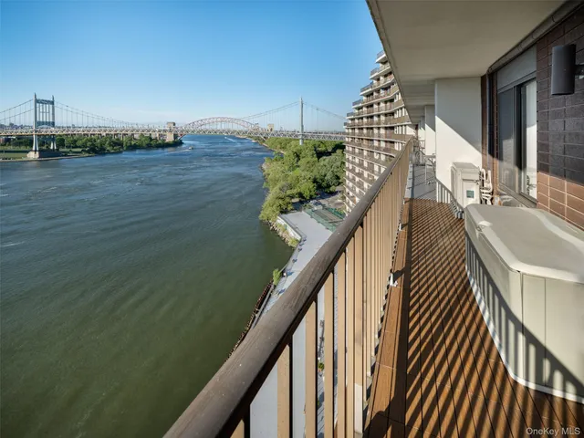 a view of a balcony with wooden floor