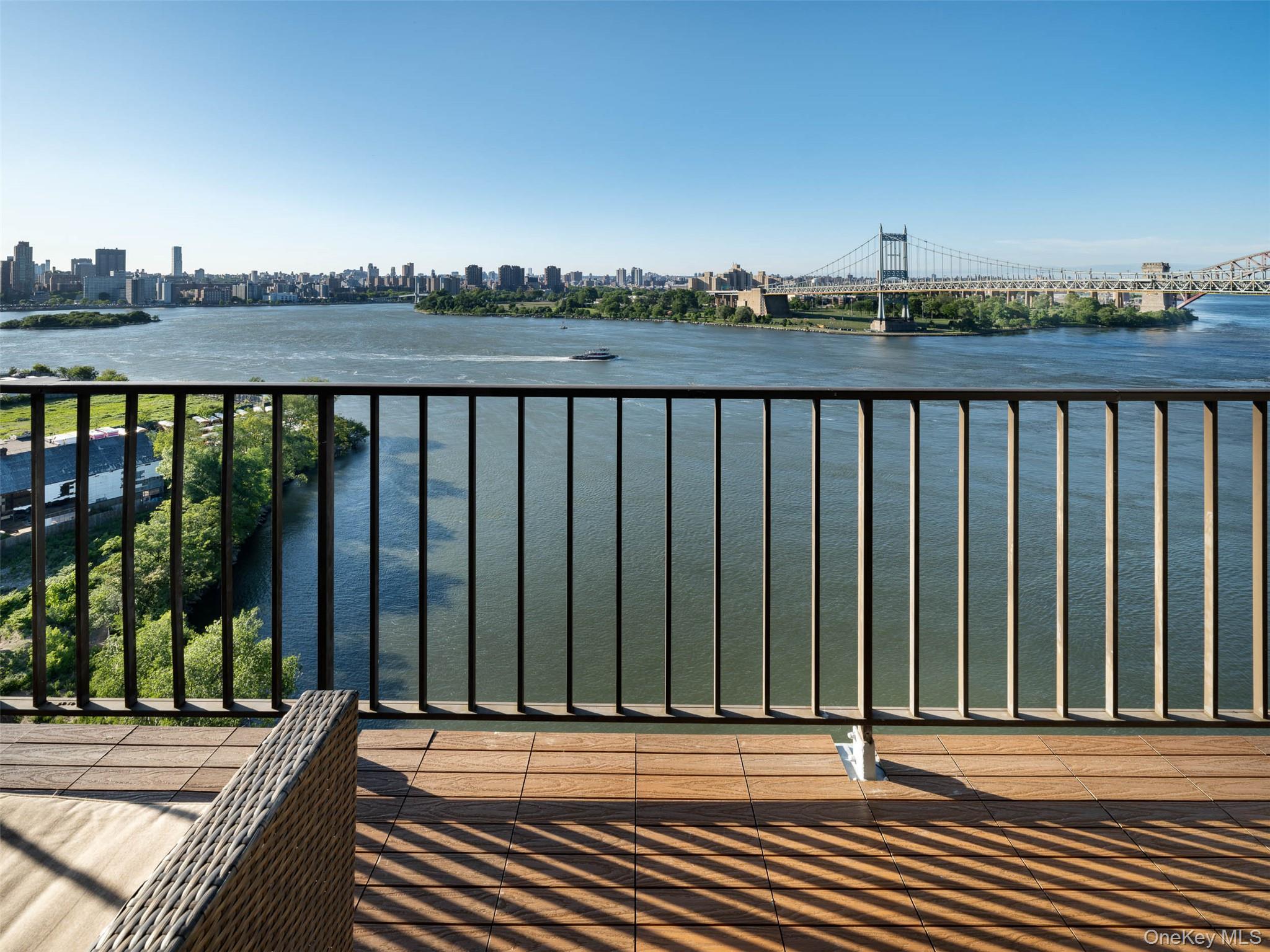 25-40 Shore Boulevard, Unit 17K Queens, NY 11102 - Photo 15 of 19 a view of a balcony with wooden floor