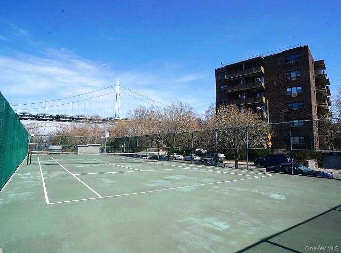 25-40 Shore Boulevard, Unit 17K Queens, NY 11102 - Photo 19 of 19 a view of a tennis ground with large trees