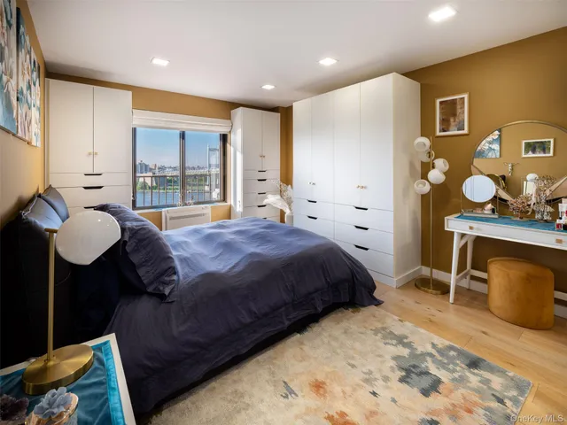 a spacious bedroom with a bed and window