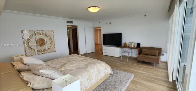 a bedroom with a bed and furniture