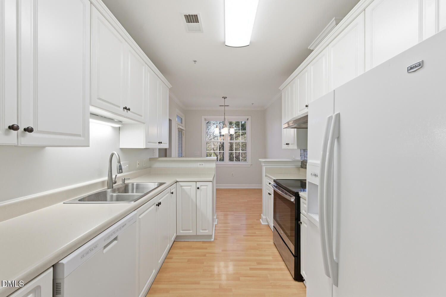 116 Northbrook Drive, Unit 204 Raleigh, NC 27609 - Photo 22 of 94 a kitchen with a sink stove and refrigerator