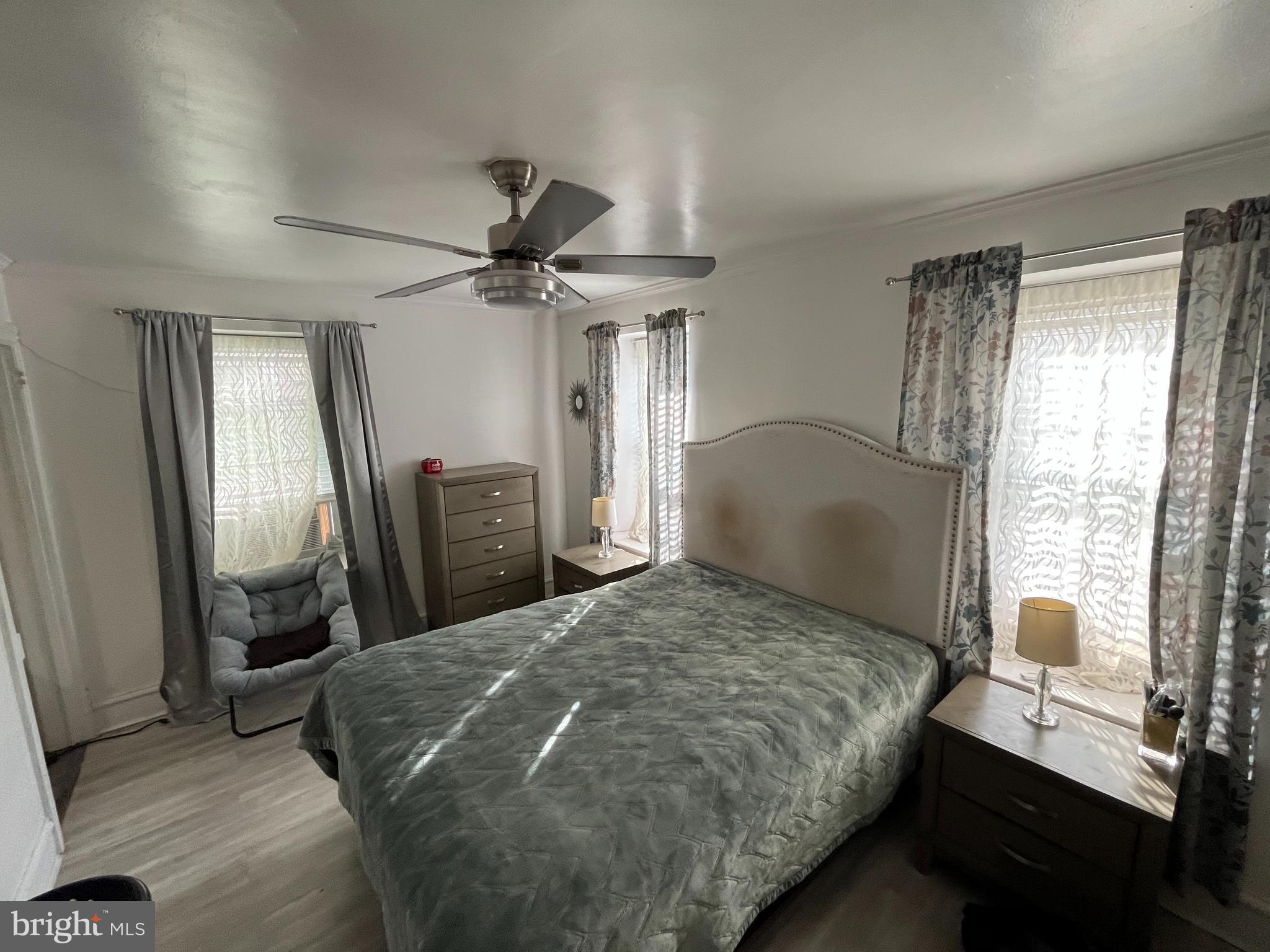 326 Randolph Avenue Ambler, PA 19002 - Photo 11 of 30 a bedroom with a bed a window and a chandelier