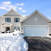 a view of a house with snow on the wall