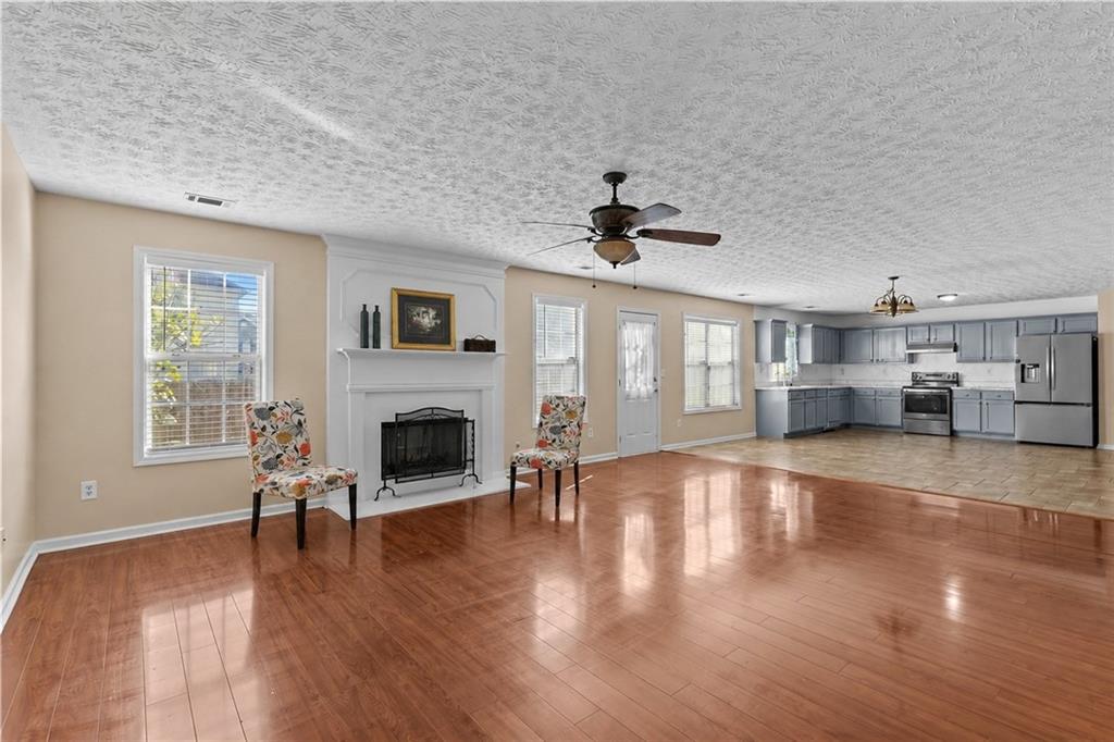 2760 Rusticwood Drive Southwest Snellville, GA 30078 - Photo 11 of 50 a view of a livingroom with furniture a fireplace