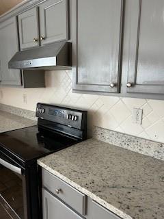 2760 Rusticwood Drive Southwest Snellville, GA 30078 - Photo 18 of 50 a kitchen with granite countertop a sink and a stove