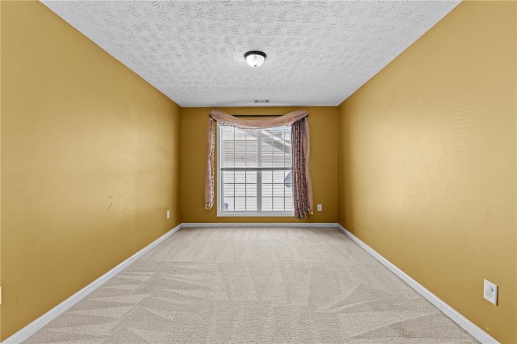2760 Rusticwood Drive Southwest Snellville, GA 30078 - Photo 25 of 50 a view of an empty room with a window