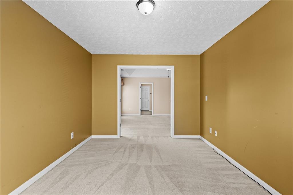 2760 Rusticwood Drive Southwest Snellville, GA 30078 - Photo 26 of 50 a view of a livingroom with wooden floor and a ceiling fan