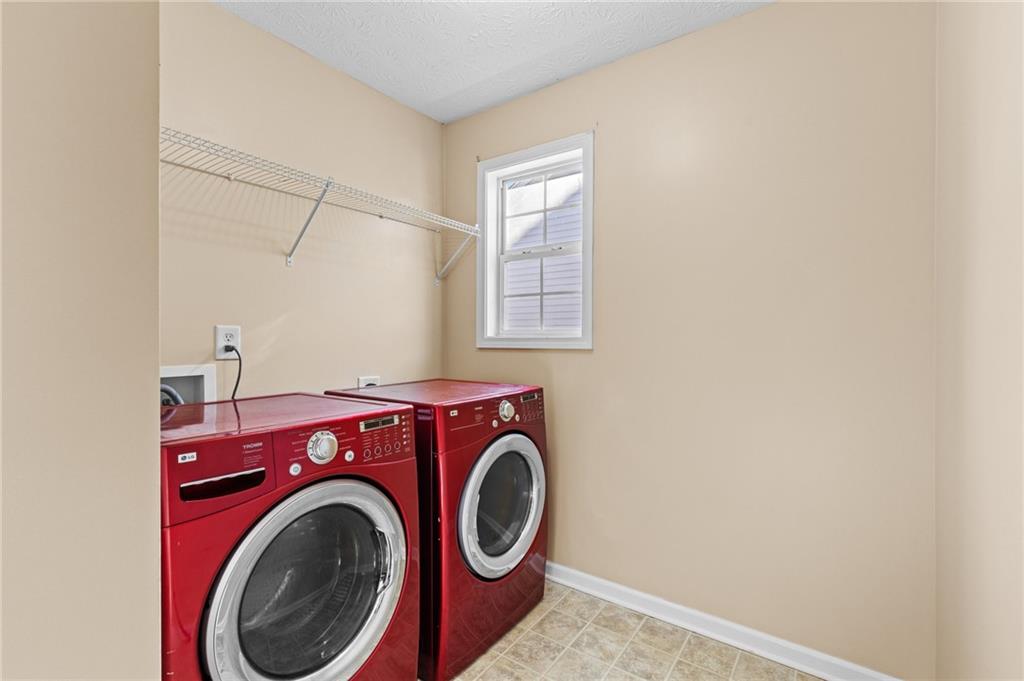 2760 Rusticwood Drive Southwest Snellville, GA 30078 - Photo 40 of 50 a utility room with dryer and washer
