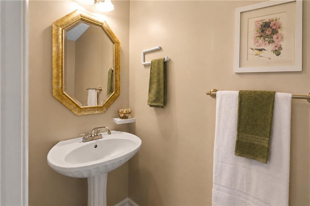 2760 Rusticwood Drive Southwest Snellville, GA 30078 - Photo 10 of 50 a bathroom with a sink and mirror