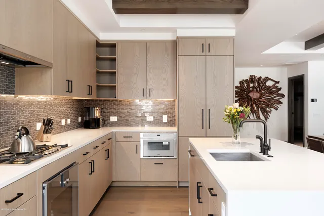 a kitchen with a white cabinets and white appliances