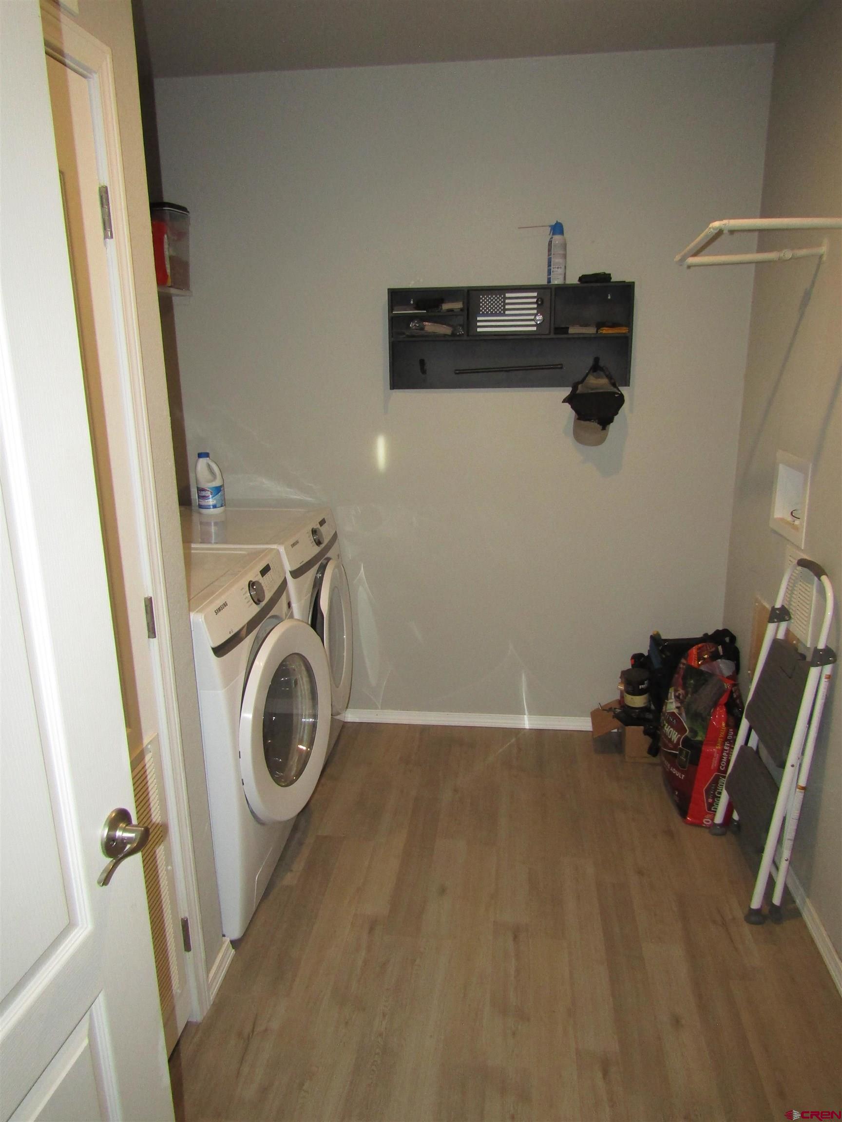 4784 Alpine Ranch Alamosa, CO 81101 - Photo 13 of 15 a utility room with dryer and washer