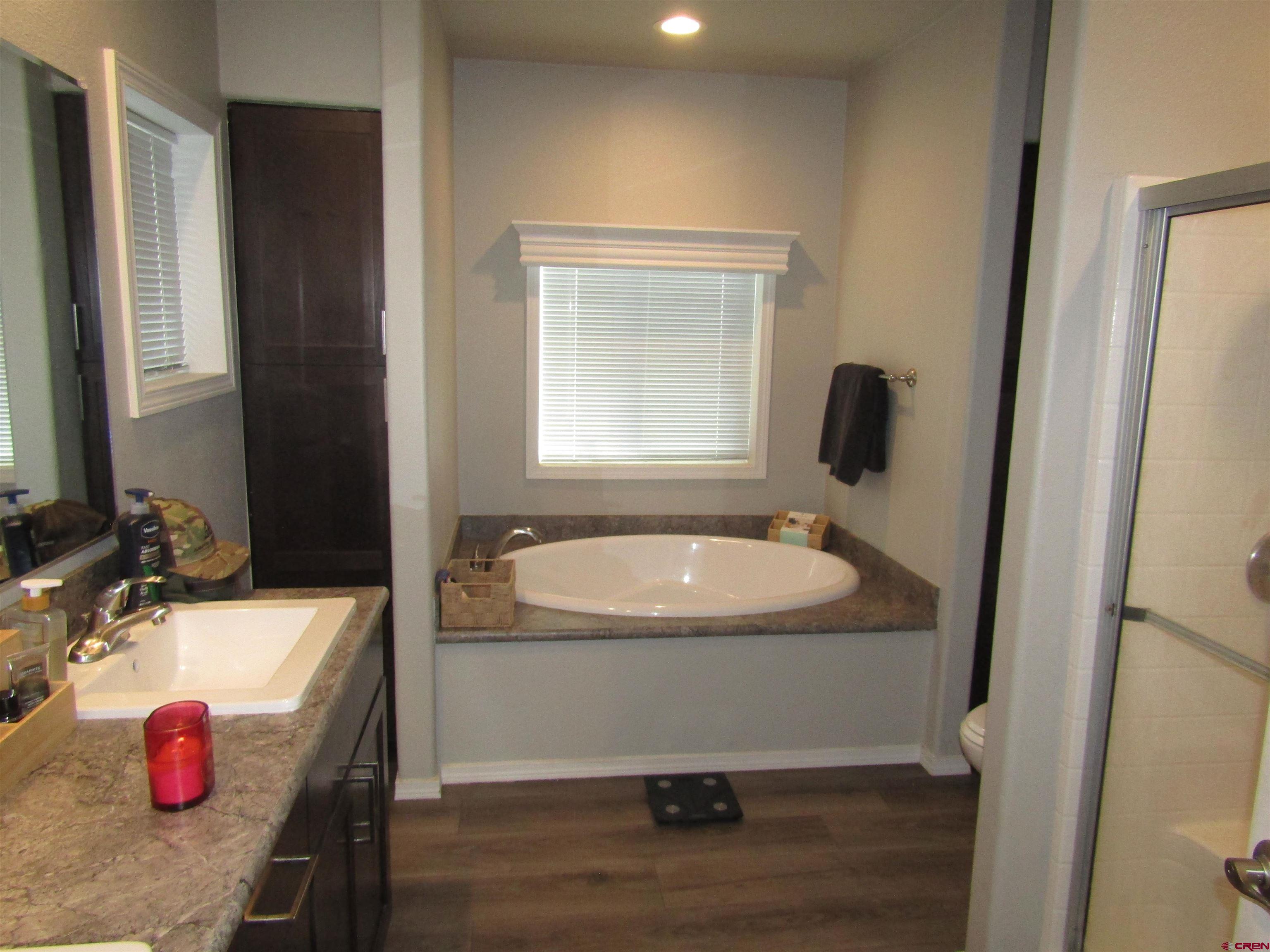 4784 Alpine Ranch Alamosa, CO 81101 - Photo 9 of 15 a bathroom with a sink and a mirror
