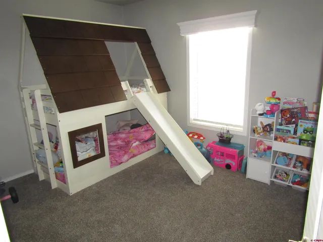 a living room with baby toys