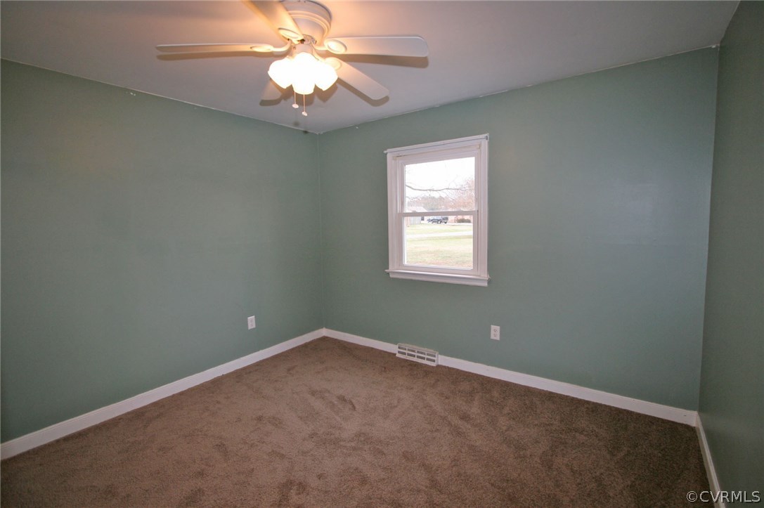 3500 Respess Road Midlothian, VA 23112 - Photo 12 of 16 an empty room with a window and ceiling fan