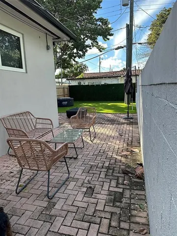 a view of yard with patio