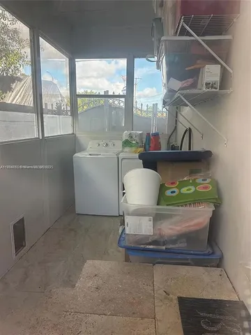 a view of entryway and kitchen