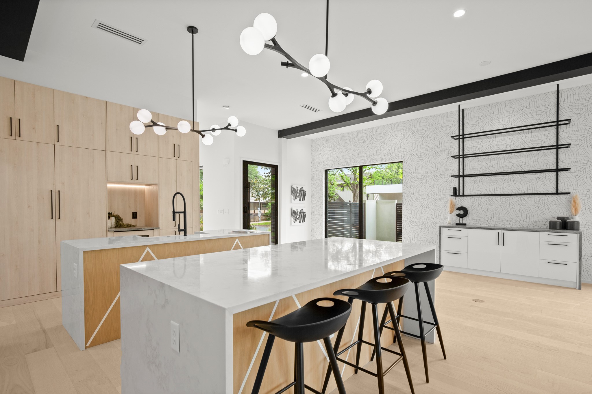 2215 South 3rd Street Austin, TX 78704 - Photo 10 of 38 a kitchen with a table chairs and chandelier