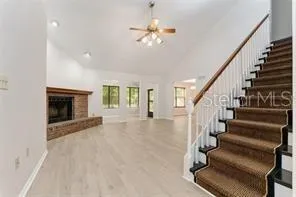 wooden floor in an empty room with a fireplace