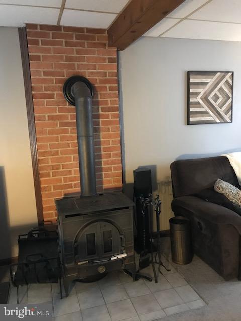 651 Owl Hill Road Lititz, PA 17543 - Photo 19 of 31 Cozy Brick and Tile Hearth w/ Woodstove.