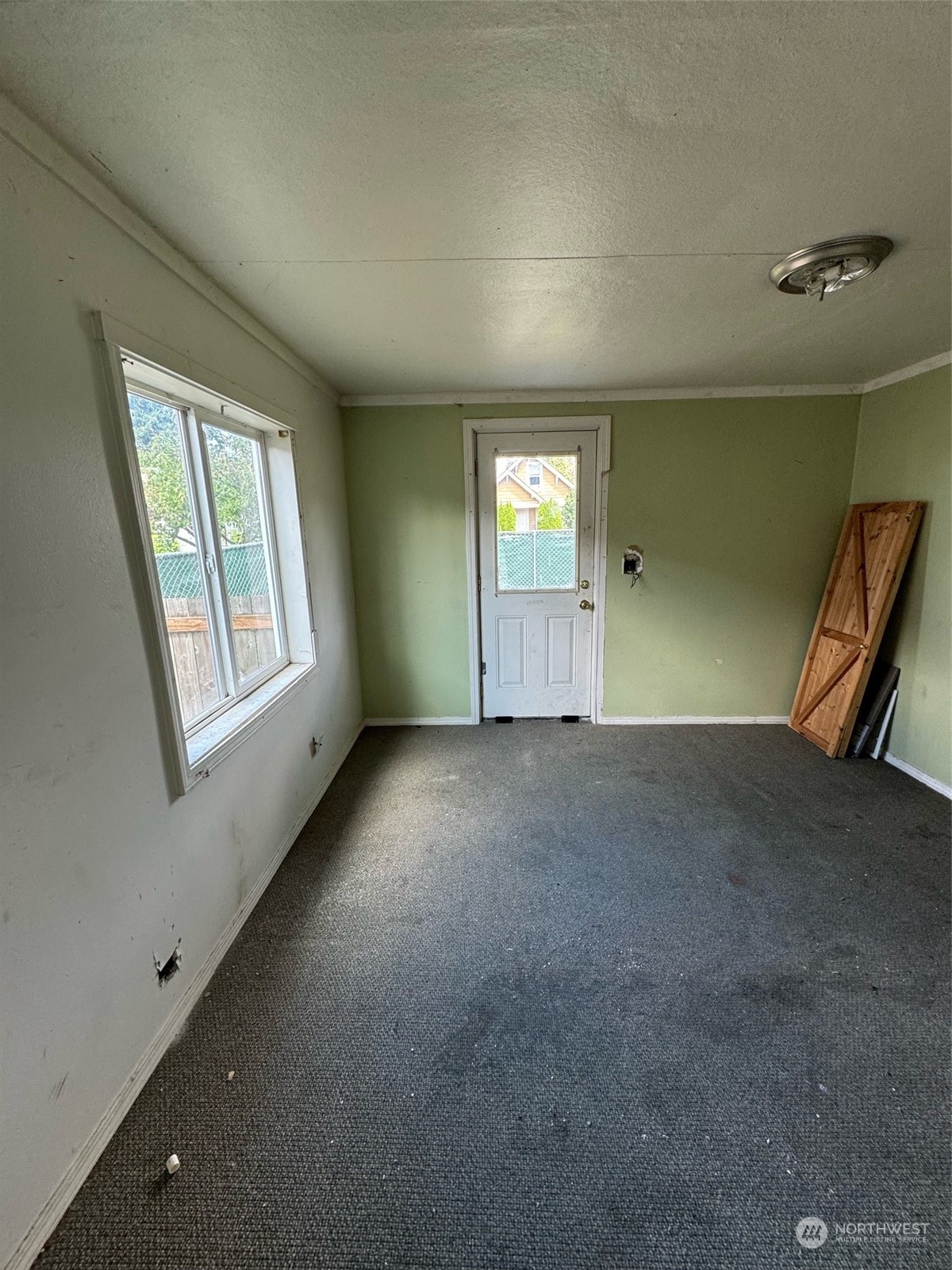 1521 North 3rd Street Renton, WA 98057 - Photo 5 of 10 a view of an empty room with a window
