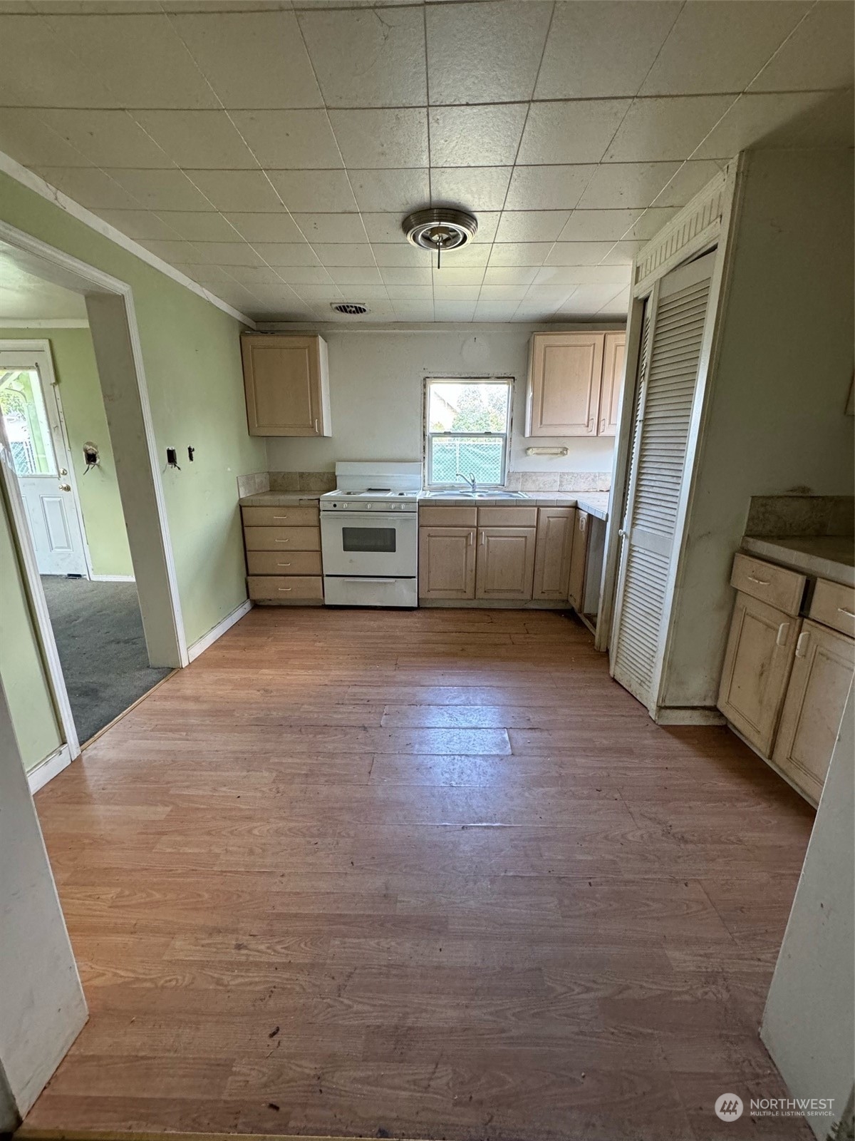 1521 North 3rd Street Renton, WA 98057 - Photo 8 of 10 a view of a kitchen with a sink cabinets and a window