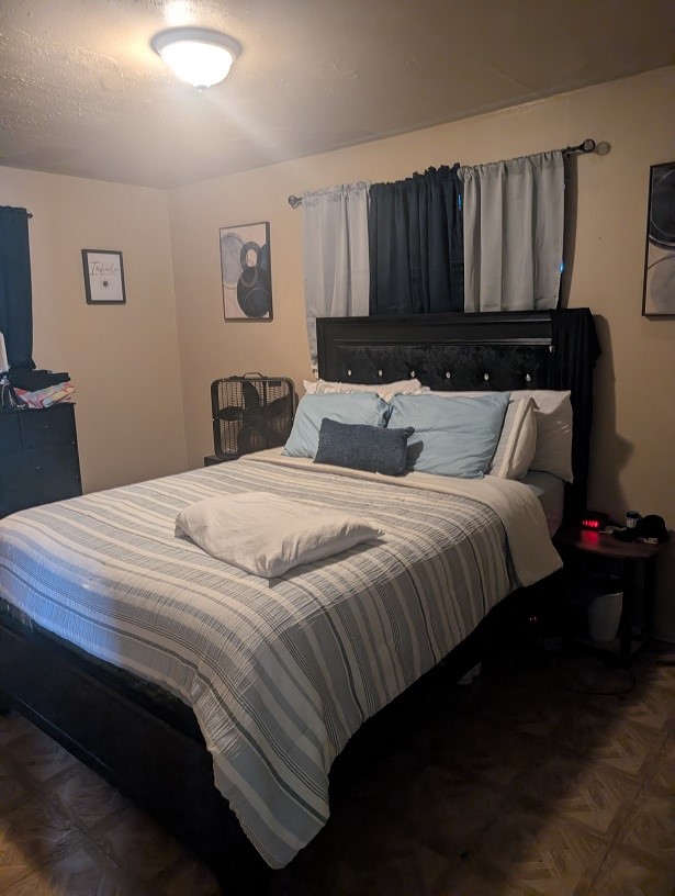 3626 Corder Street Houston, TX 77021 - Photo 5 of 6 a bedroom with bed and wooden floor