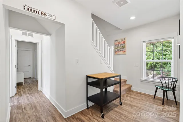a view of a livingroom with furniture and wooden floor